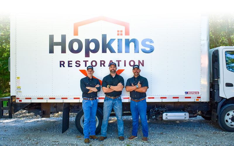 Hopkins Restoration Team in front of their truck